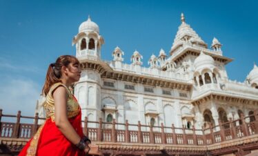 Woman in red sari at temple