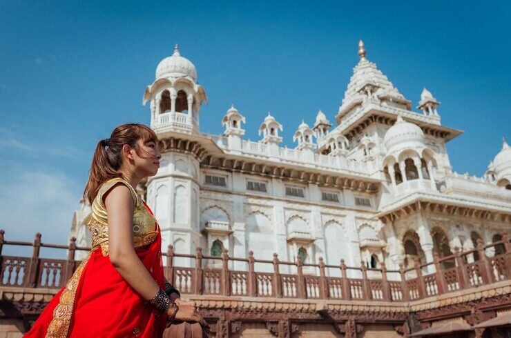 Woman in red sari at temple